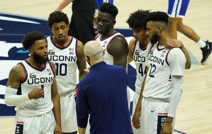 Nov 25, 2020; Storrs, CT, USA; Connecticut Huskies head coach Dan Hurley talks to guard R.J. Cole (1) and guard Brendan Adams (10) and forward Adama Sanogo (middle top) and guard Andre Jackson (44) and forward Tyler Polley (12) during a break in the action against the Central Connecticut State Blue Devils in the second half at Gampel Pavilion. Mandatory Credit: David Butler II-USA TODAY Sports