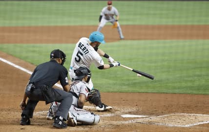 Apr 14, 2023; Miami, Florida, USA; Miami Marlins third baseman Jon Berti (5) doubles against the Arizona Diamondbacks during the fifth inning at loanDepot Park. Mandatory Credit: Rhona Wise-USA TODAY Sports