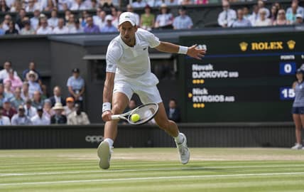 Jul 10, 2022; London, United Kingdom; Novak Djokovic (SRB) returns a shot during the men   s final against Nick Kyrgios (not pictured) on day 14 at All England Lawn Tennis and Croquet Club. Mandatory Credit: Susan Mullane-USA TODAY Sports