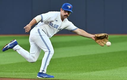 Aug 29, 2023; Toronto, Ontario, CAN;  Toronto Blue Jays second baseman Davis Schneider (36) cannot reach a ball hit for a single by Washington Nationals first baseman Dominic Smith (not pictured) in the second inning at Rogers Centre. Mandatory Credit: Dan Hamilton-USA TODAY Sports