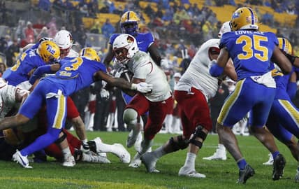 Oct 14, 2023; Pittsburgh, Pennsylvania, USA; Louisville Cardinals running back Isaac Guerendo (middle) scores a touchdown against the Pittsburgh Panthers during the second quarter at Acrisure Stadium. Mandatory Credit: Charles LeClaire-USA TODAY Sports
