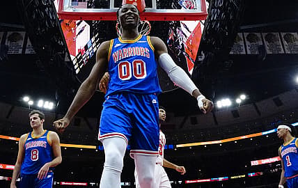 Jan 14, 2022; Chicago, Illinois, USA; Golden State Warriors forward Jonathan Kuminga (00) reacts after a defensive play against the Chicago Bulls during the second half at United Center. Mandatory Credit: David Banks-USA TODAY Sports