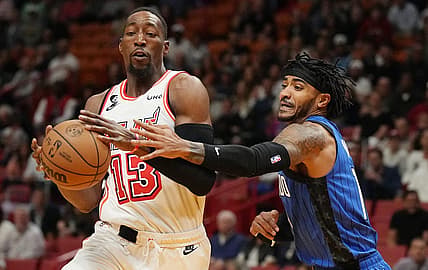 Jan 27, 2023; Miami, Florida, USA; Orlando Magic guard Gary Harris (14) defends Miami Heat center Bam Adebayo (13) during the first half at Miami-Dade Arena. Mandatory Credit: Jim Rassol-USA TODAY Sports