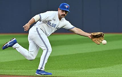 Aug 29, 2023; Toronto, Ontario, CAN;  Toronto Blue Jays second baseman Davis Schneider (36) cannot reach a ball hit for a single by Washington Nationals first baseman Dominic Smith (not pictured) in the second inning at Rogers Centre. Mandatory Credit: Dan Hamilton-USA TODAY Sports