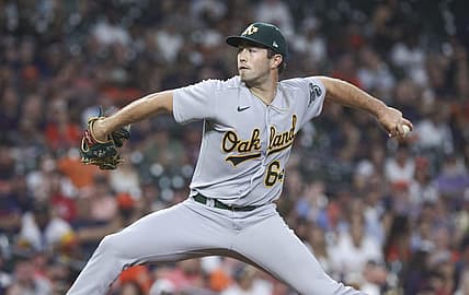 Sep 11, 2023; Houston, Texas, USA; Oakland Athletics relief pitcher Ken Waldichuk (64) delivers a pitch during the sixth inning against the Houston Astros at Minute Maid Park. Mandatory Credit: Troy Taormina-USA TODAY Sports