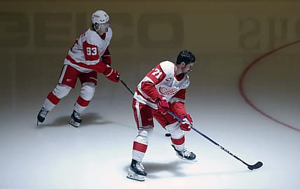 Oct 4, 2023; Pittsburgh, Pennsylvania, USA; Detroit Red Wings right wing Alex DeBrincat (93) and center Dylan Larkin (71) takes the ice to warm up before the game against the Pittsburgh Penguins at PPG Paints Arena. Mandatory Credit: Charles LeClaire-USA TODAY Sports