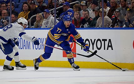 Oct 17, 2023; Buffalo, New York, USA;  Tampa Bay Lightning left wing Brandon Hagel (38) defends as Buffalo Sabres right wing JJ Peterka (77)looks to make a pass during the first period at KeyBank Center. Mandatory Credit: Timothy T. Ludwig-USA TODAY Sports