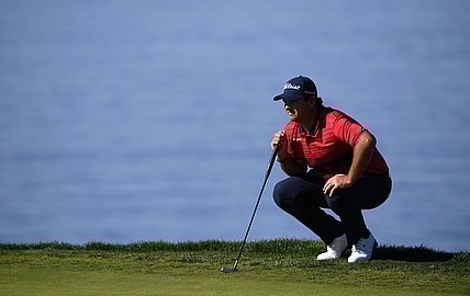 Jan 31, 2021; San Diego, California, USA; Patrick Reed lines up a putt on the second green during the final round of the Farmers Insurance Open golf tournament at Torrey Pines Municipal Golf Course - South Course. Mandatory Credit: Orlando Ramirez-USA TODAY Sports
