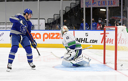Feb 6, 2021; Toronto, Ontario, CAN; Toronto Maple Leafs forward Auston Matthews (34) scores against Vancouver Canucks goalie Braden Holtby (49) in the third period at Scotiabank Arena. Mandatory Credit: Dan Hamilton-USA TODAY Sports