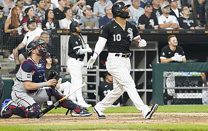 Jul 20, 2021; Chicago, Illinois, USA; Chicago White Sox third baseman Yoan Moncada (10) hits a two-run home run against the Minnesota Twins during the third inning at Guaranteed Rate Field. Mandatory Credit: David Banks-USA TODAY Sports