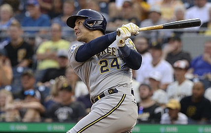 Jul 27, 2021; Pittsburgh, Pennsylvania, USA;  Milwaukee Brewers right fielder Avisail Garcia (24) hits an RBI double against the Pittsburgh Pirates during the second inning at PNC Park. Mandatory Credit: Charles LeClaire-USA TODAY Sports