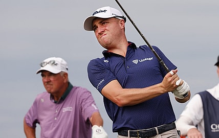 Dec 17, 2022; Orlando, Florida, USA;  Justin Thomas watches his drive on the tenth tee with father Mike Thomas looking on during the first round of the PNC Championship golf tournament at Ritz Carlton Golf Club Grande Lakes Orlando Course. Mandatory Credit: Reinhold Matay-USA TODAY Sports