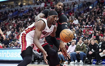 Nov 18, 2023; Chicago, Illinois, USA; Chicago Bulls center Andre Drummond (3) defends Miami Heat center Bam Adebayo (13) during the first half at United Center. Mandatory Credit: David Banks-USA TODAY Sports