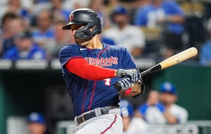Sep 20, 2022; Kansas City, Missouri, USA; Minnesota Twins shortstop Carlos Correa (4) hits a two-run single against the Kansas City Royals during the second inning at Kauffman Stadium. Mandatory Credit: Jay Biggerstaff-USA TODAY Sports