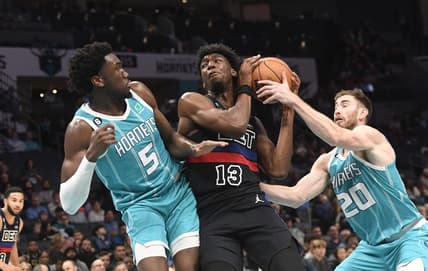 Feb 27, 2023; Charlotte, North Carolina, USA; Detroit Pistons center James Wiseman (13) gets a rebound from Charlotte Hornets center Mark Williams (5) and forward Gordon Hayward (20) during the second half at the Spectrum Center. Mandatory Credit: Sam Sharpe-USA TODAY Sports