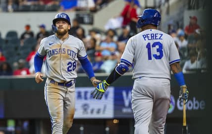 Apr 11, 2023; Arlington, Texas, USA;  Kansas City Royals center fielder Kyle Isbel (28) celebrates with Kansas City Royals catcher Salvador Perez (13) after scoring during the third inning against the Texas Rangers at Globe Life Field. Mandatory Credit: Kevin Jairaj-USA TODAY Sports