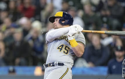 Apr 19, 2023; Seattle, Washington, USA; Milwaukee Brewers first baseman Luke Voit (45) hits an RBI-single during the seventh inning against the Seattle Mariners at T-Mobile Park. Mandatory Credit: Stephen Brashear-USA TODAY Sports