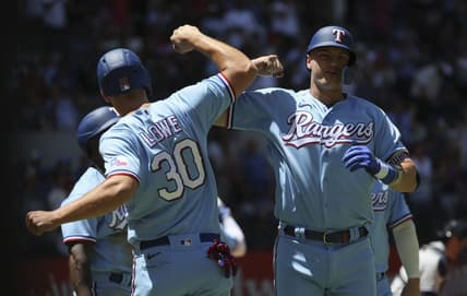 Apr 30, 2023; Arlington, Texas, USA;  Texas Rangers third baseman Josh Jung (6) celebrates with Texas Rangers first baseman Nathaniel Lowe (30) after hitting a grand slam during the first inning against the New York Yankees at Globe Life Field. Mandatory Credit: Kevin Jairaj-USA TODAY Sports