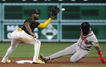 Aug 7, 2023; Pittsburgh, Pennsylvania, USA; Atlanta Braves designated hitter Marcell Ozuna (right) steals second base as Pittsburgh Pirates second baseman Liover Peguero (left) takes the throw during the sixth inning at PNC Park. Mandatory Credit: Charles LeClaire-USA TODAY Sports