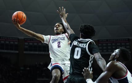 Jan 31, 2024; Storrs, Connecticut, USA; UConn Huskies guard Tristen Newton (2) shoots against Providence Friars guard Davonte Gaines (0) in the first half at Harry A. Gampel Pavilion. Mandatory Credit: David Butler II-USA TODAY Sports