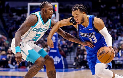 Dec 13, 2021; Dallas, Texas, USA;  Dallas Mavericks guard Jalen Brunson (13) drives to the basket as Charlotte Hornets guard Terry Rozier (3) defends during the first quarter at American Airlines Center. Mandatory Credit: Kevin Jairaj-USA TODAY Sports