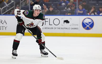 Dec 11, 2023; Buffalo, New York, USA;  Arizona Coyotes center Logan Cooley (92) waits for the face-off during the third period against the Buffalo Sabres at KeyBank Center. Mandatory Credit: Timothy T. Ludwig-USA TODAY Sports