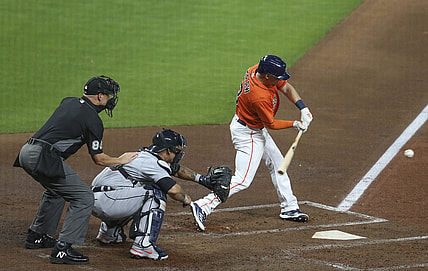 Apr 13, 2021; Houston, Texas, USA; Houston Astros center fielder Myles Straw (3) hits a RBI single against the Detroit Tigers in second inning at Minute Maid Park. Mandatory Credit: Thomas Shea-USA TODAY Sports
