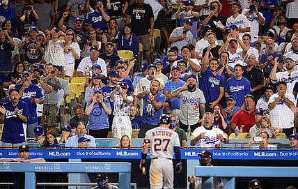 Aug 3, 2021; Los Angeles, California, USA; Spectators react after Houston Astros second baseman Jose Altuve (27) strikes out against the Los Angeles Dodgers during the fifth inning at Dodger Stadium. Mandatory Credit: Gary A. Vasquez-USA TODAY Sports