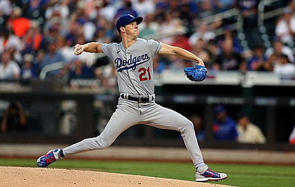 Aug 14, 2021; New York City, New York, USA; Los Angeles Dodgers starting pitcher Walker Buehler (21) throws against the New York Mets during the first inning at Citi Field. Mandatory Credit: Andy Marlin-USA TODAY Sports