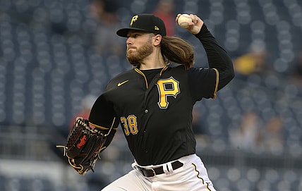 Sep 14, 2021; Pittsburgh, Pennsylvania, USA; Pittsburgh Pirates starting pitcher Dillon Peters (38) delivers against the Cincinnati Reds during the first inning at PNC Park. Mandatory Credit: Charles LeClaire-USA TODAY Sports