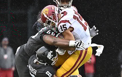 Sep 18, 2021; Pullman, Washington, USA; USC Trojans wide receiver Drake London (15) is hit hard by Washington State Cougars defensive lineman Amir Mujahid (48) and Washington State Cougars defensive back Armani Marsh (8) in the first half at Gesa Field at Martin Stadium. Mandatory Credit: James Snook-USA TODAY Sports