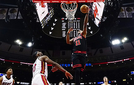 Nov 18, 2023; Chicago, Illinois, USA; Miami Heat center Bam Adebayo (13) defends Chicago Bulls forward DeMar DeRozan (11) during the second half at United Center. Mandatory Credit: David Banks-USA TODAY Sports
