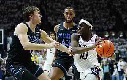 Feb 24, 2024; Storrs, Connecticut, USA; UConn Huskies guard Hassan Diarra (10) drives the ball against Villanova Wildcats forward Eric Dixon (43) and guard Brendan Hausen (1) in the second half at Harry A. Gampel Pavilion. Mandatory Credit: David Butler II-USA TODAY Sports