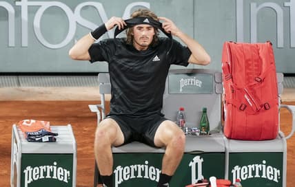 (File photo) Stefanos Tsitsipas (GRE) puts on a new headband at a change of ends during his match against Novak Djokovic (SRB) on day 13 at Stade Roland Garros. Mandatory Credit: Susan Mullane-USA TODAY Sports
