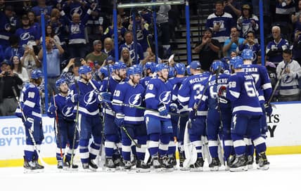 May 26, 2021; Tampa, Florida, USA;Tampa Bay Lightning right wing Barclay Goodrow (19) and teammates  celebrate as they beat the Florida Panthers during game six of the first round of the 2021 Stanley Cup Playoffs at Amalie Arena. Mandatory Credit: Kim Klement-USA TODAY Sports