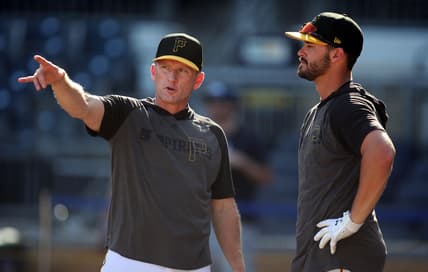 Sep 17, 2019; Pittsburgh, PA, USA;  Pittsburgh Pirates hitting coach Rick Eckstein (left) talks with left fielder Kevin Kramer (right) at the batting cage before the game against the Seattle Mariners at PNC Park. Mandatory Credit: Charles LeClaire-USA TODAY Sports