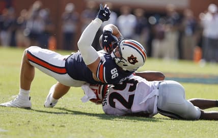Oct 9, 2021; Auburn, Alabama, USA;  Auburn Tigers tight end Luke Deal (86) rolls over Georgia Bulldogs defensive back Christopher Smith (29) during the first quarter at Jordan-Hare Stadium. Mandatory Credit: John Reed-USA TODAY Sports