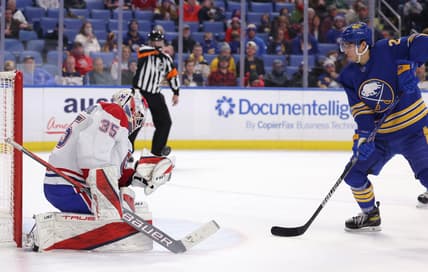 Nov 26, 2021; Buffalo, New York, USA;  Buffalo Sabres center Dylan Cozens (24) waits for a rebound as Montreal Canadiens goaltender Sam Montembeault (35) tries to make a glove save during the second period at KeyBank Center. Mandatory Credit: Timothy T. Ludwig-USA TODAY Sports