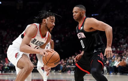 Mar 25, 2022; Portland, Oregon, USA; Portland Trail Blazers forward Trendon Watford (2) drives to the basket on Houston Rockets guard Eric Gordon (10) during the first quarter the game at Moda Center. Mandatory Credit: Steve Dykes-USA TODAY Sports
