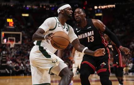 Jan 12, 2023; Miami, Florida, USA; Milwaukee Bucks forward Bobby Portis (9) dribbles against Miami Heat center Bam Adebayo (13) at The Arena. Mandatory Credit: Jasen Vinlove-USA TODAY Sports