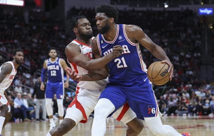 Dec 5, 2022; Houston, Texas, USA; Philadelphia 76ers center Joel Embiid (21) controls the ball as Houston Rockets forward Bruno Fernando (20) defends during the third quarter at Toyota Center. Mandatory Credit: Troy Taormina-USA TODAY Sports