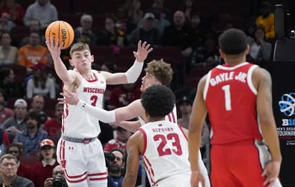 Mar 8, 2023; Chicago, IL, USA; Wisconsin Badgers guard Connor Essegian (3) grabs a rebound against the Ohio State Buckeyes during the first half at United Center. Mandatory Credit: David Banks-USA TODAY Sports