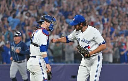 Apr 14, 2023; Toronto, Ontario, CAN;    Toronto Blue Jays relief pitcher Jordan Romano (68) celebrates with catcher Danny Jansen (9) after a 6-3 win over the Tampa Bay Rays at Rogers Centre. Mandatory Credit: Dan Hamilton-USA TODAY Sports