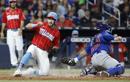 Apr 29, 2023; Miami, Florida, USA; Miami Marlins shortstop Garrett Hampson (1) scores against the Chicago Cubs during the third inning at loanDepot Park. Mandatory Credit: Rhona Wise-USA TODAY Sports