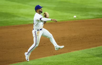 May 2, 2023; Arlington, Texas, USA; Texas Rangers shortstop Ezequiel Duran (20) fields a ground ball and throws to first base during the sixth inning against the Arizona Diamondbacks at Globe Life Field. Mandatory Credit: Kevin Jairaj-USA TODAY Sports