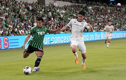 Jun 21, 2023; Austin, Texas, USA; Austin FC defender Nick Lima (24) crosses the ball against FC Dallas defender Marco Farfan (4) during the second half at Q2 Stadium. Mandatory Credit: Scott Wachter-USA TODAY Sports