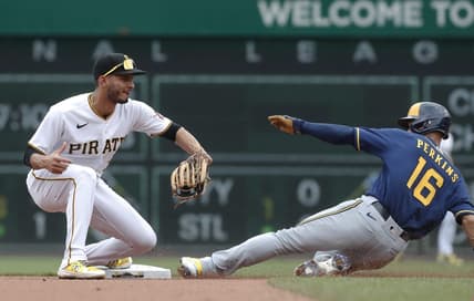 Jul 2, 2023; Pittsburgh, Pennsylvania, USA;  Pittsburgh Pirates shortstop Tucupita Marcano (30) takes a throw to force Milwaukee Brewers left fielder Blake Perkins (16) out at second base during the fourth inning at PNC Park. Mandatory Credit: Charles LeClaire-USA TODAY Sports