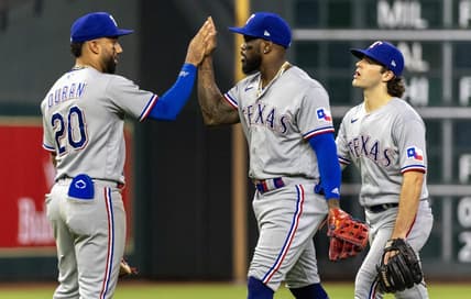 Jul 26, 2023; Houston, Texas, USA; Texas Rangers right fielder Adolis Garcia (53) and  shortstop Ezequiel Duran (20) celebrate the win against the Houston Astros in the ninth inning at Minute Maid Park. Mandatory Credit: Thomas Shea-USA TODAY Sports