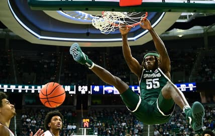 Nov 9, 2023; East Lansing, Michigan, USA; Michigan State Spartans forward Coen Carr (55) slams the ball through the basket during the second half against the Southern Indiana Screaming Eagles at Jack Breslin Student Events Center. Mandatory Credit: Dale Young-USA TODAY Sports