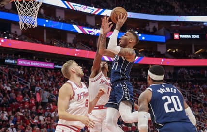Dec 22, 2023; Houston, Texas, USA; Dallas Mavericks guard Dexter Dennis (17) shoots against Houston Rockets forward Amen Thompson (1) in the second half at Toyota Center. Mandatory Credit: Thomas Shea-USA TODAY Sports